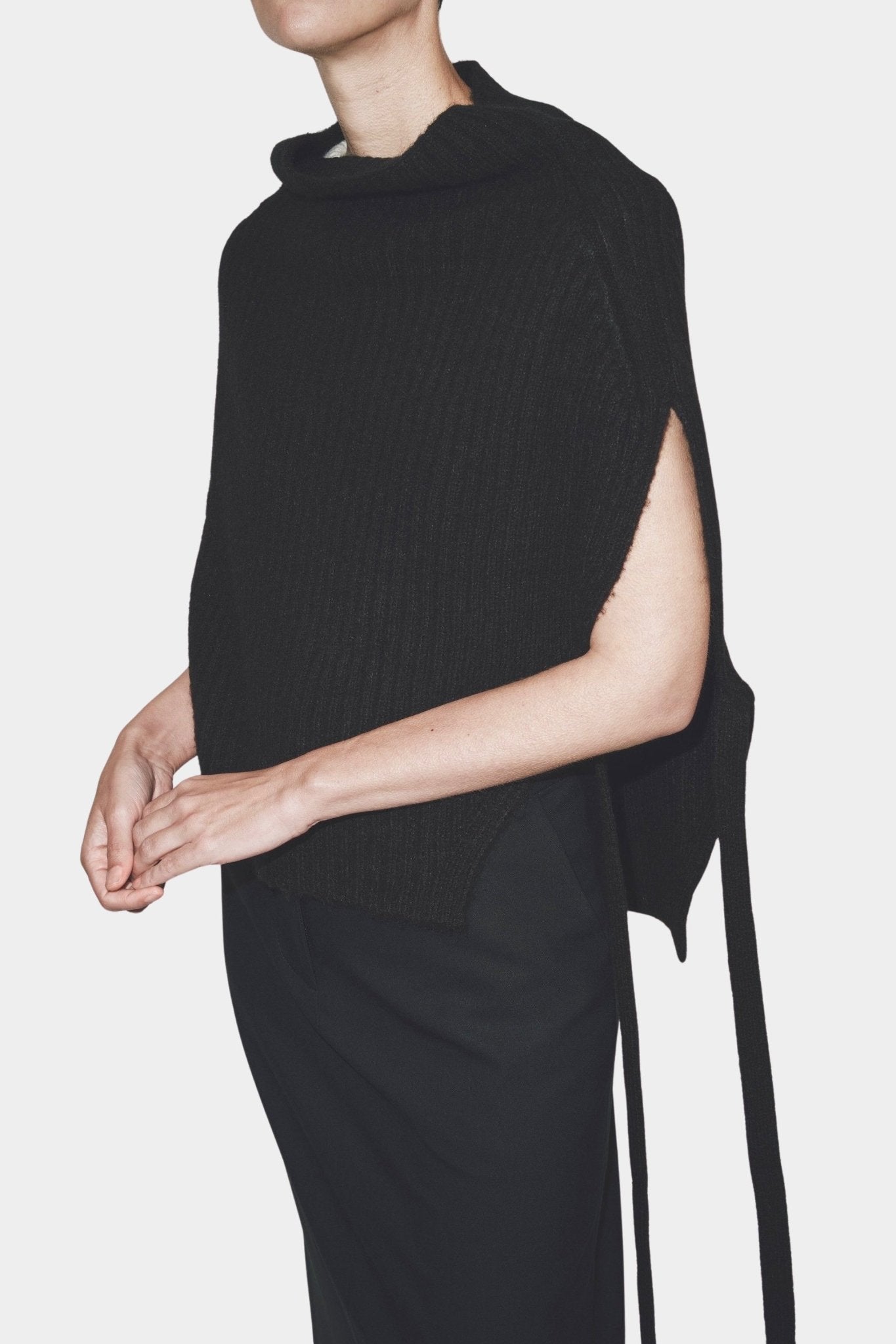 Black ribbed knit neck warmer with open sides by Mijeong Park