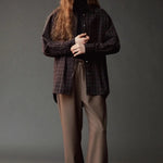 Front view of the Mijeong Park brown plaid shirt layered over a black turtleneck