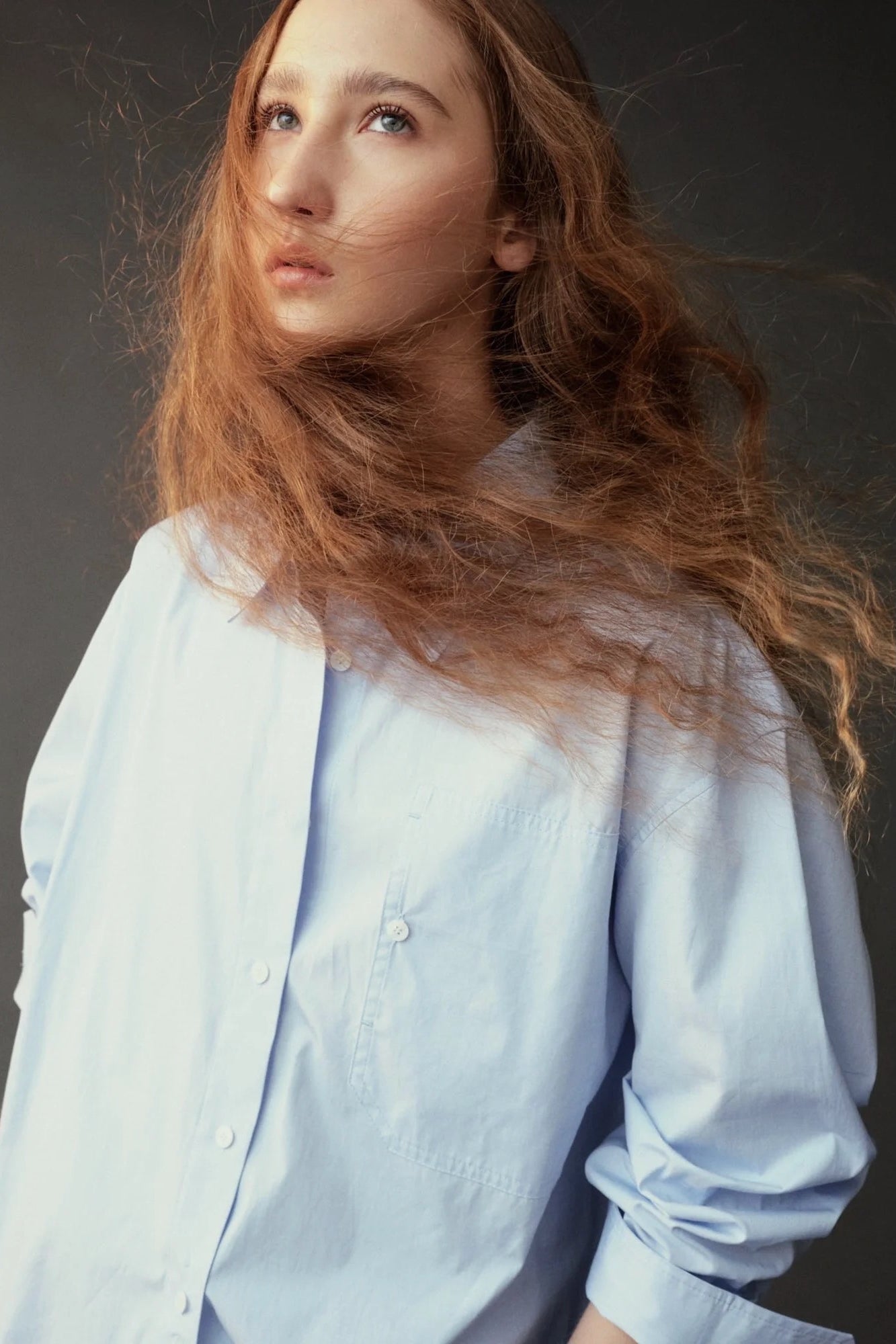 Close front view of the Mijeong Park light blue shirt showing the collar, buttons, and chest pocket