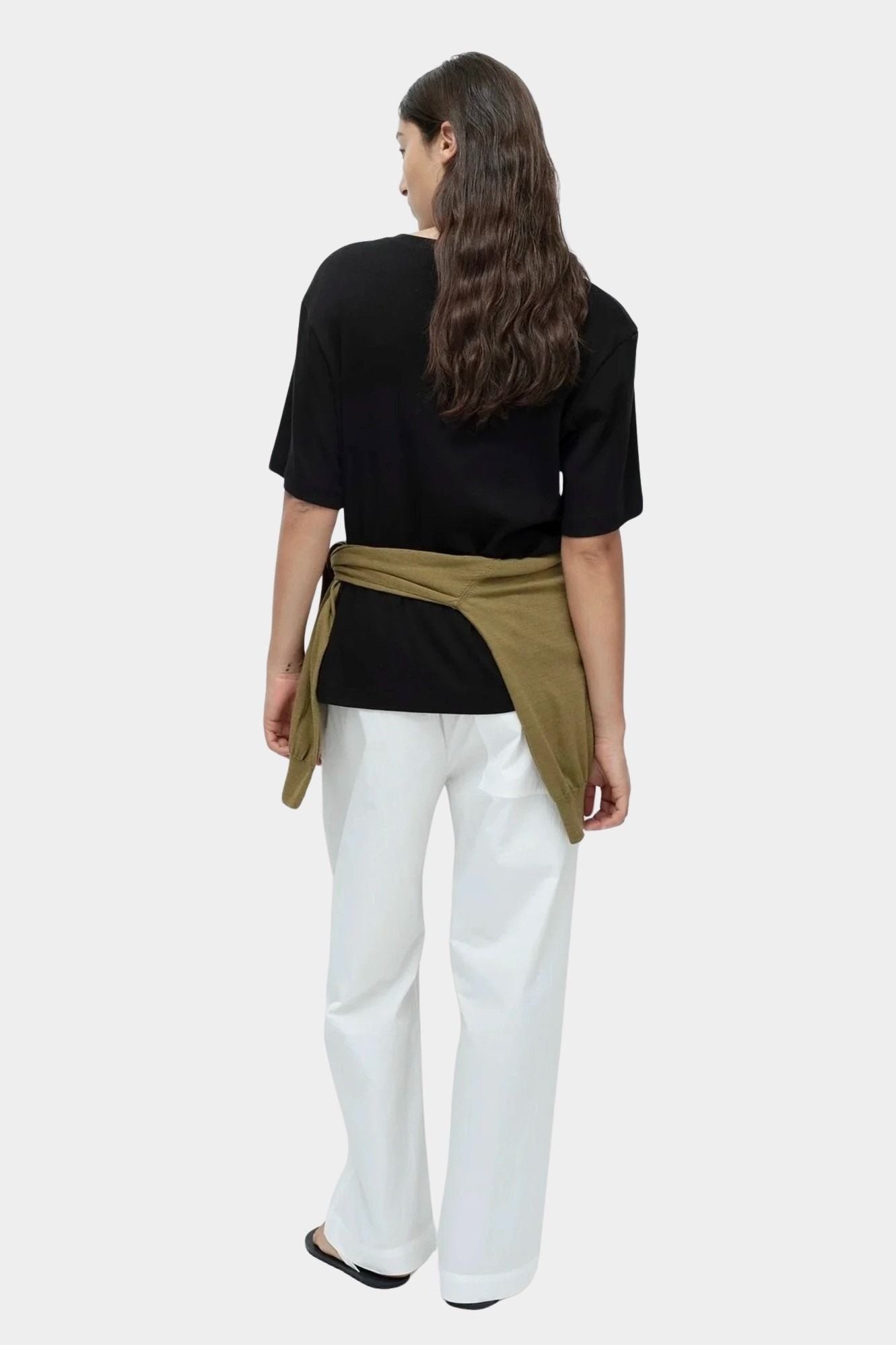 Mijeong Park oversized black cotton t shirt back view styled outfit with white wide leg trousers minimalist womens designer clothing