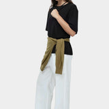Mijeong Park oversized black cotton t shirt relaxed minimalist crewneck tee styled outfit white wide leg trousers womens designer clothing
