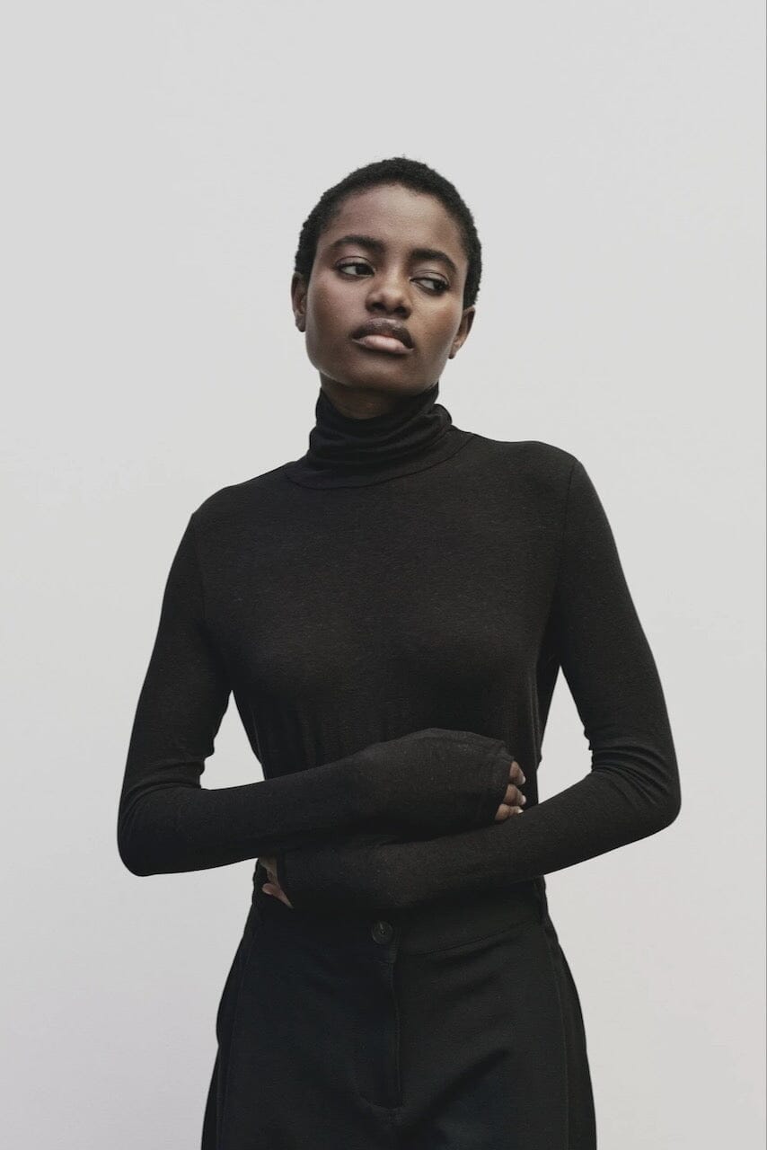 Black slim fit Tencel cotton roll neck top by Mijeong Park