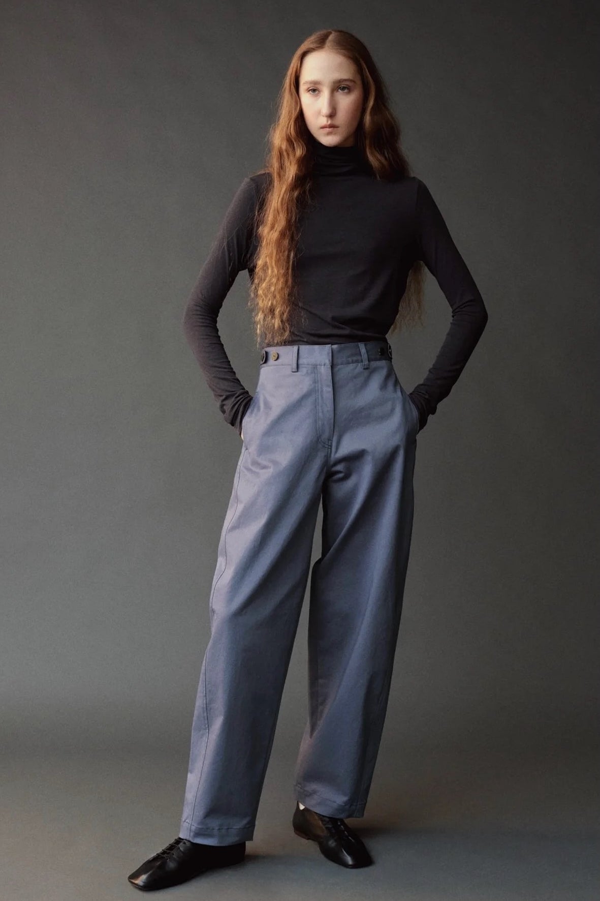 Front view of the graphite roll neck jersey top with a slim fit and long sleeves.