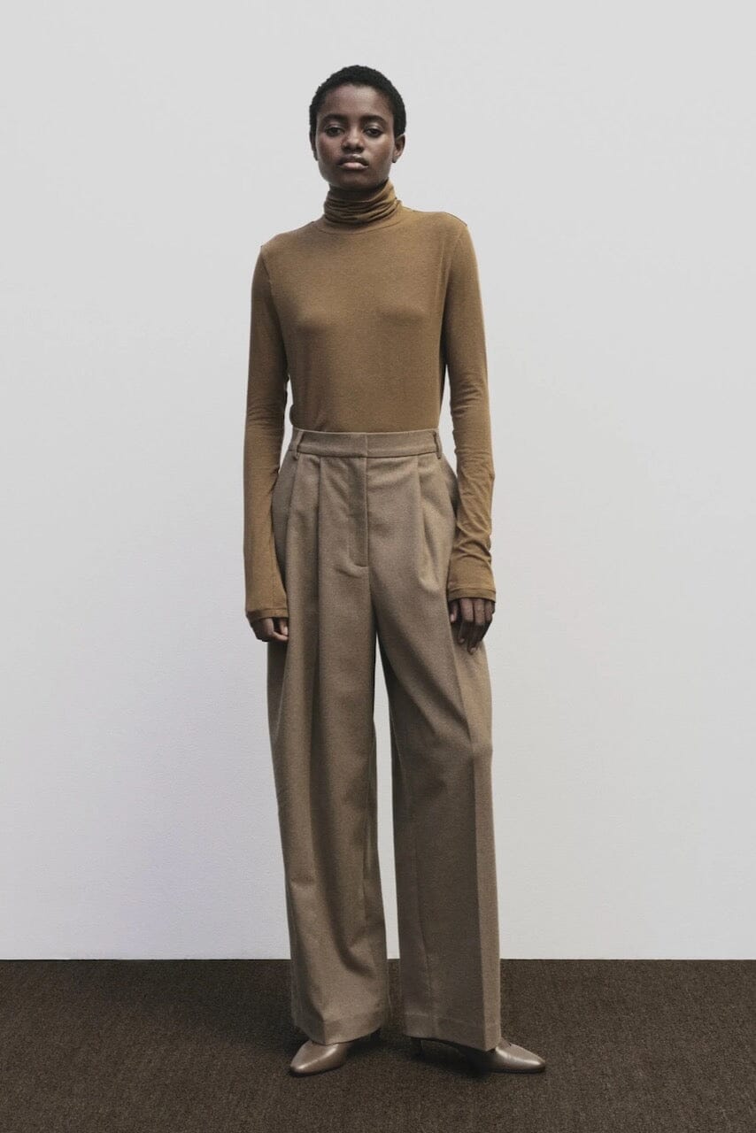 Light brown slim fit roll neck jersey top by Mijeong Park