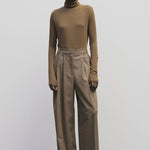 Light brown slim fit roll neck jersey top by Mijeong Park