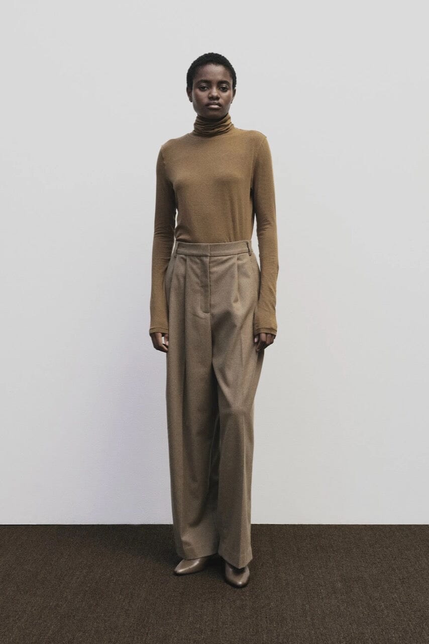Light brown slim fit roll neck jersey top by Mijeong Park