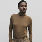 Light brown slim fit roll neck jersey top by Mijeong Park