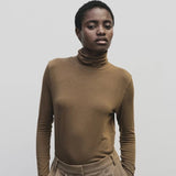 Light brown slim fit roll neck jersey top by Mijeong Park