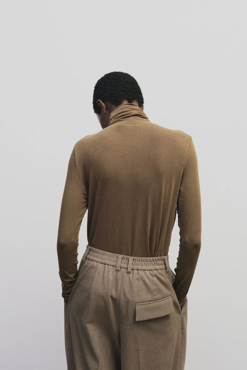 Light brown slim fit roll neck jersey top by Mijeong Park