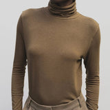 Light brown slim fit roll neck jersey top by Mijeong Park