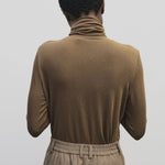 Light brown slim fit roll neck jersey top by Mijeong Park