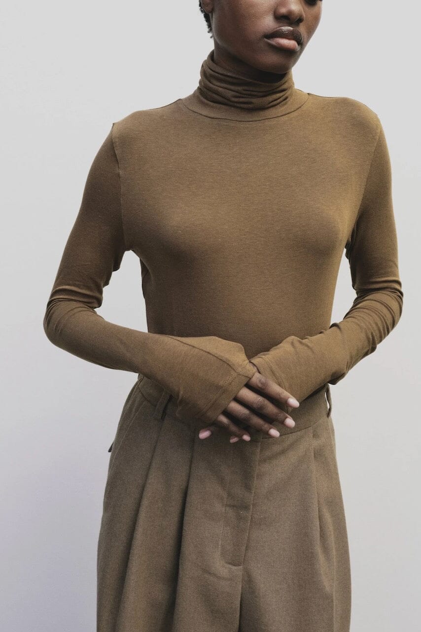 Light brown slim fit roll neck jersey top by Mijeong Park