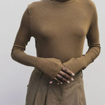 Light brown slim fit roll neck jersey top by Mijeong Park