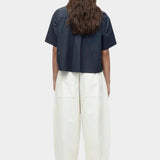 Back view of cropped navy cotton poplin short sleeve shirt with boxy silhouette