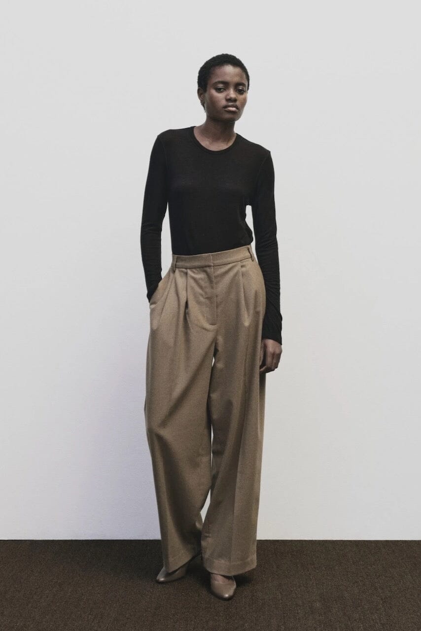 Black slim fit wool Tencel crewneck sweater by Mijeong Park