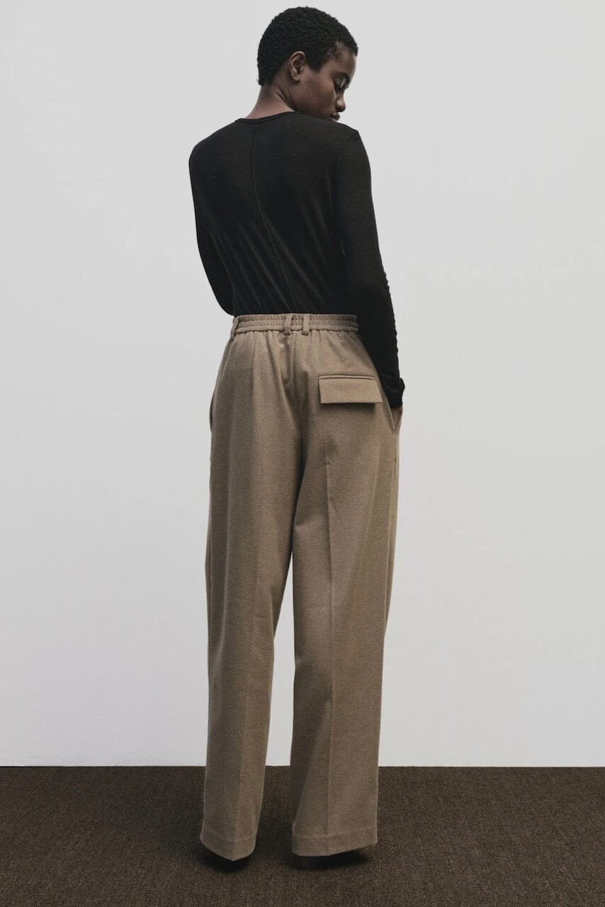 Black slim fit wool Tencel crewneck sweater by Mijeong Park