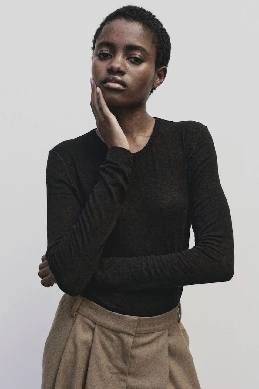 Black slim fit wool Tencel crewneck sweater by Mijeong Park