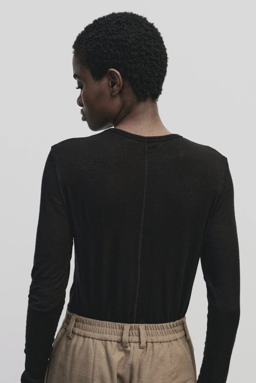 Black slim fit wool Tencel crewneck sweater by Mijeong Park