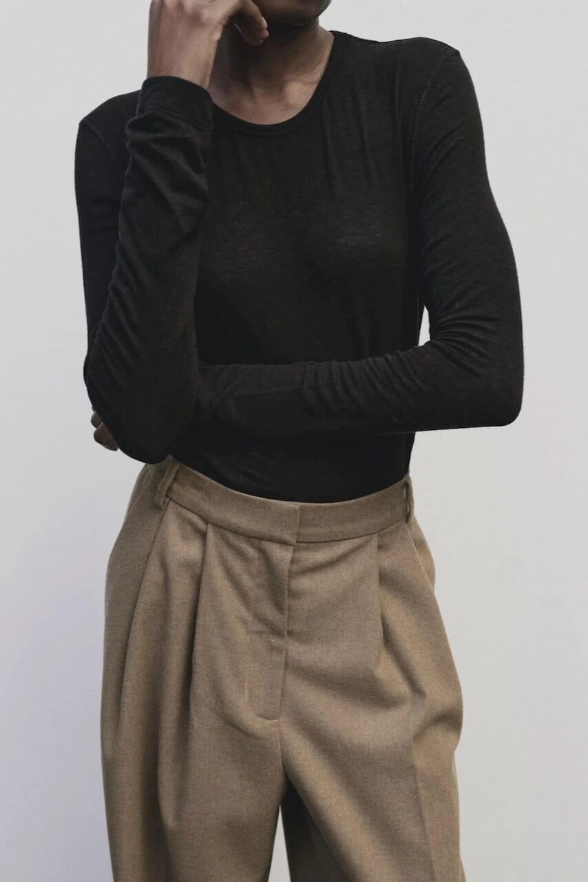 Black slim fit wool Tencel crewneck sweater by Mijeong Park