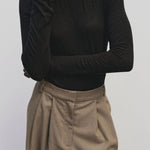 Black slim fit wool Tencel crewneck sweater by Mijeong Park
