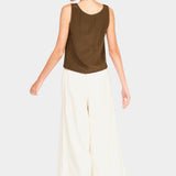 Side/back view of brown sleeveless tank showing relaxed drape and low armholes