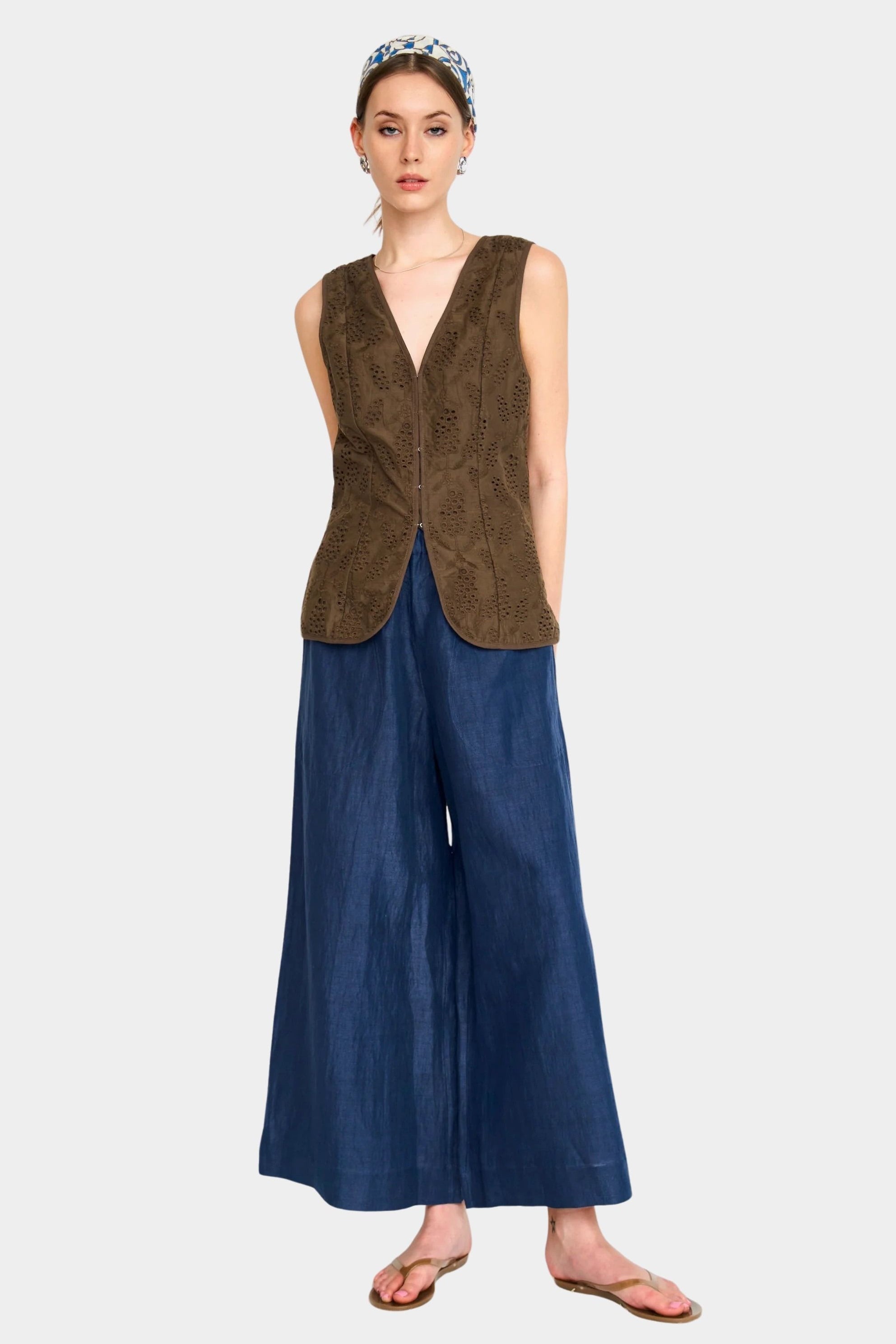 Full outfit view of blueberry wide leg pants styled with sleeveless top and sandals
