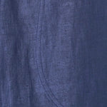 Close up of blueberry cotton fabric showing hand loomed texture and seam detail