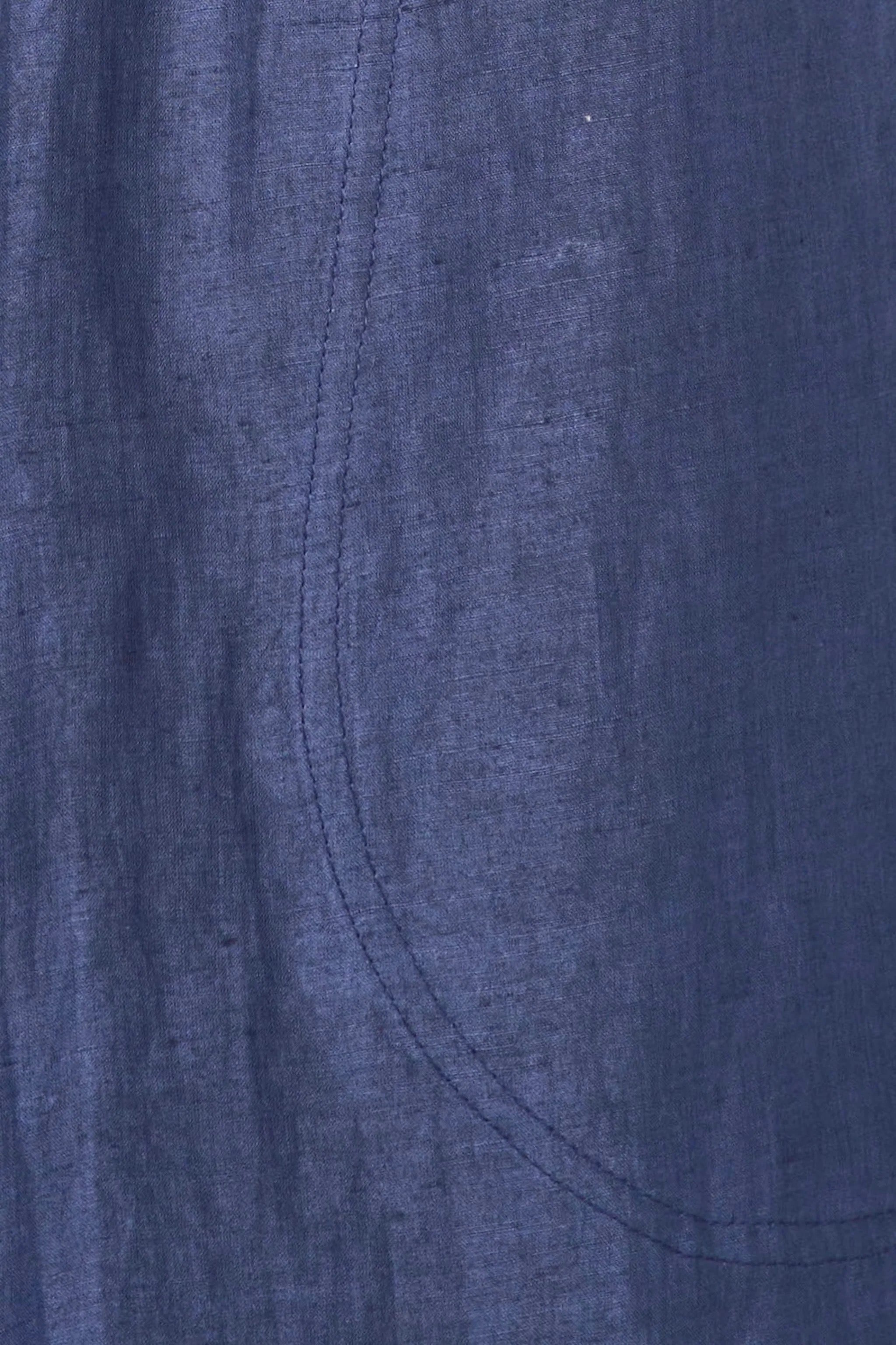 Close up of blueberry cotton fabric showing hand loomed texture and seam detail