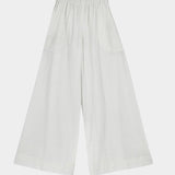 White wide leg ankle length pants flat lay with elastic waistband and loose silhouette