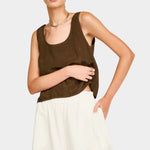 Close front view of white wide leg pants showing elastic waistband and relaxed fit through hips