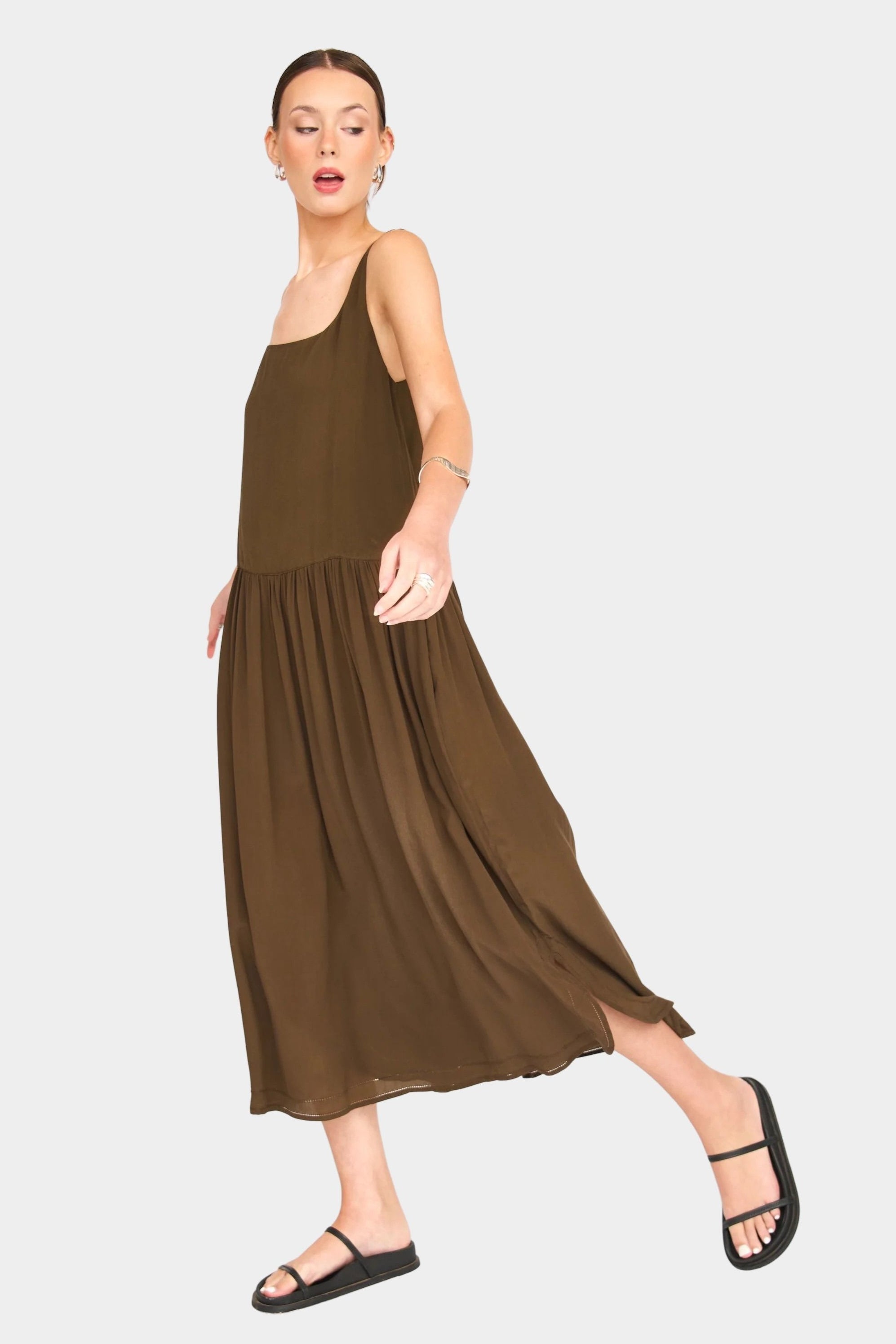 Side front view of chocolate silk midi dress showing flowy skirt and lightweight drape