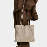 Modern Weaving Narrow Oval Tote Taupe in Italian lamb leather with slim shoulder straps and structured oval base