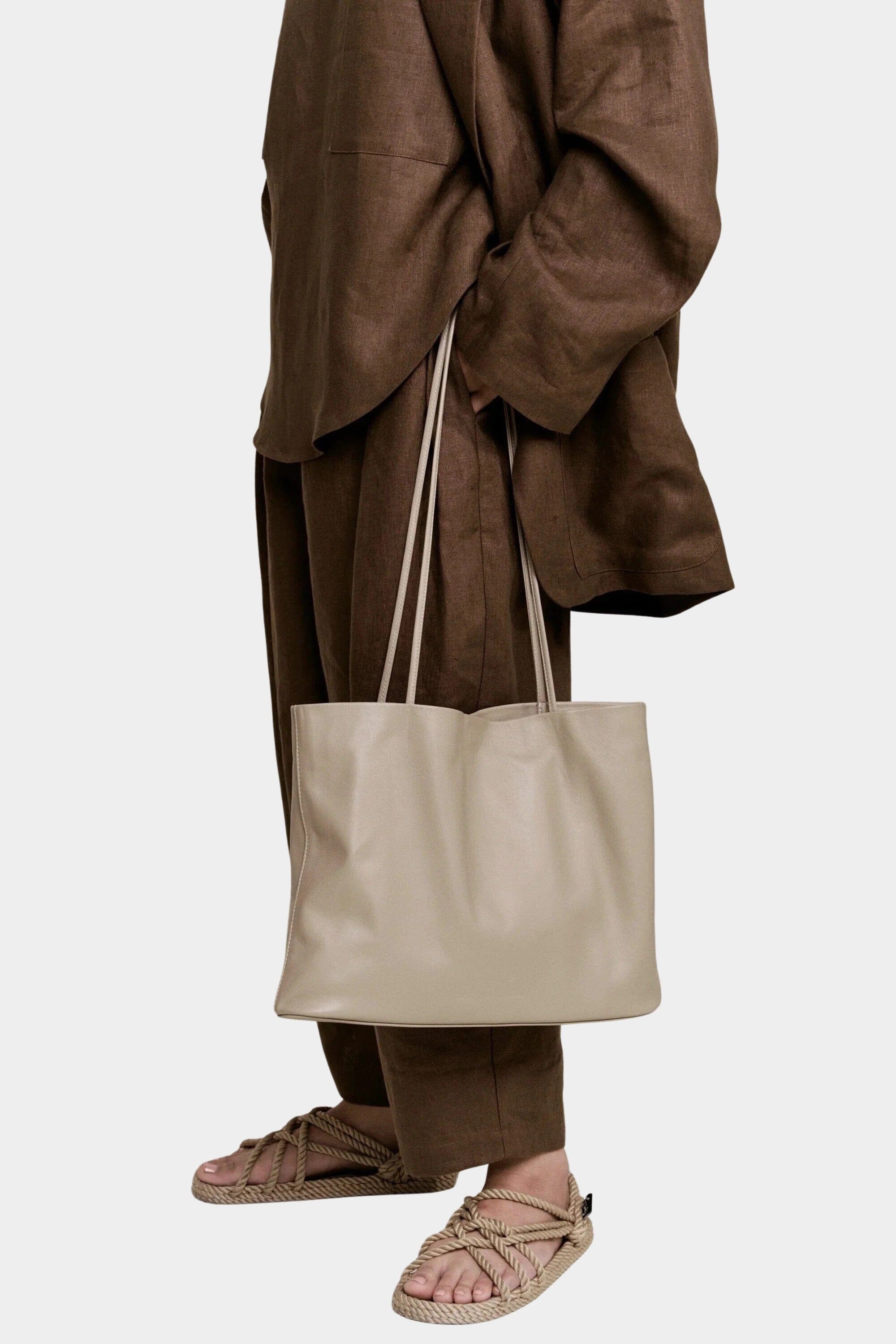 Modern Weaving Narrow Oval Tote Taupe in Italian lamb leather with slim shoulder straps and structured oval base