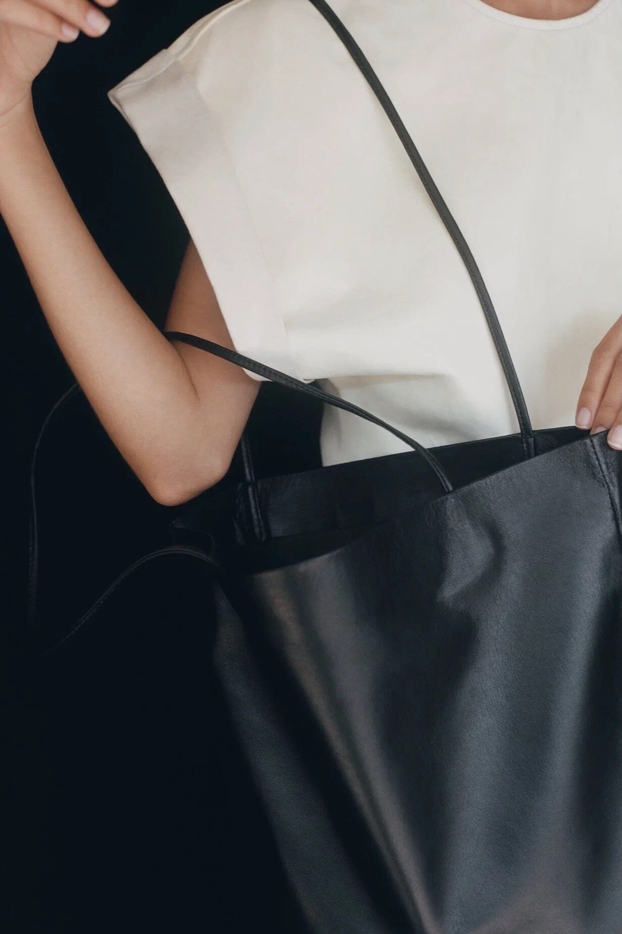 Modern Weaving Slim Lamb Sak Black worn on shoulder showing relaxed slouchy silhouette and lightweight structure