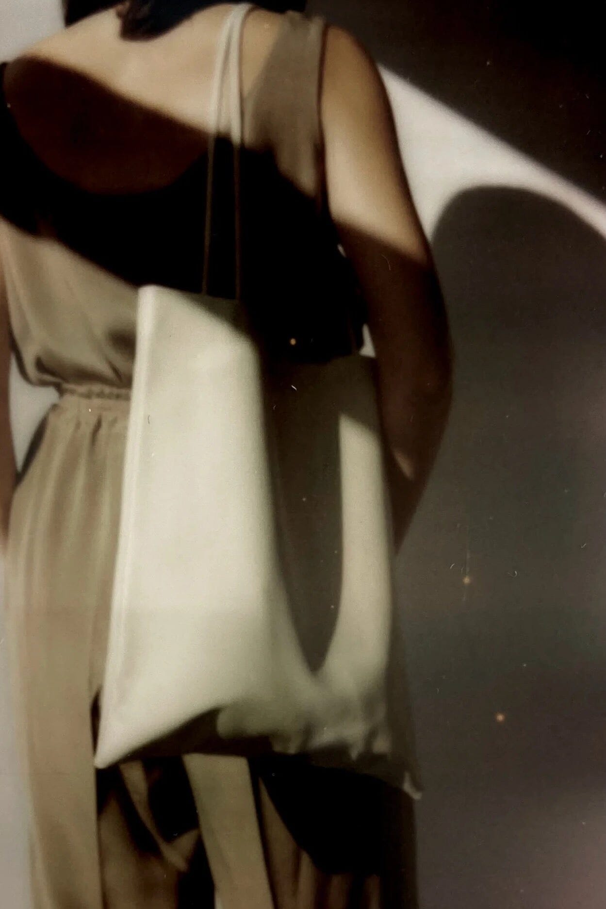 Modern Weaving Slim Lamb Sak Creme worn on shoulder showing relaxed slouchy silhouette and lightweight structure
