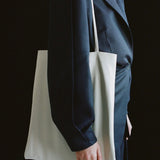 Modern Weaving Slim Lamb Sak Creme close-up of strap and leather texture showing smooth finish