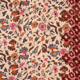 Natalie Martin Fiore Maxi Wildflower Spice floral print detail with border trim close-up