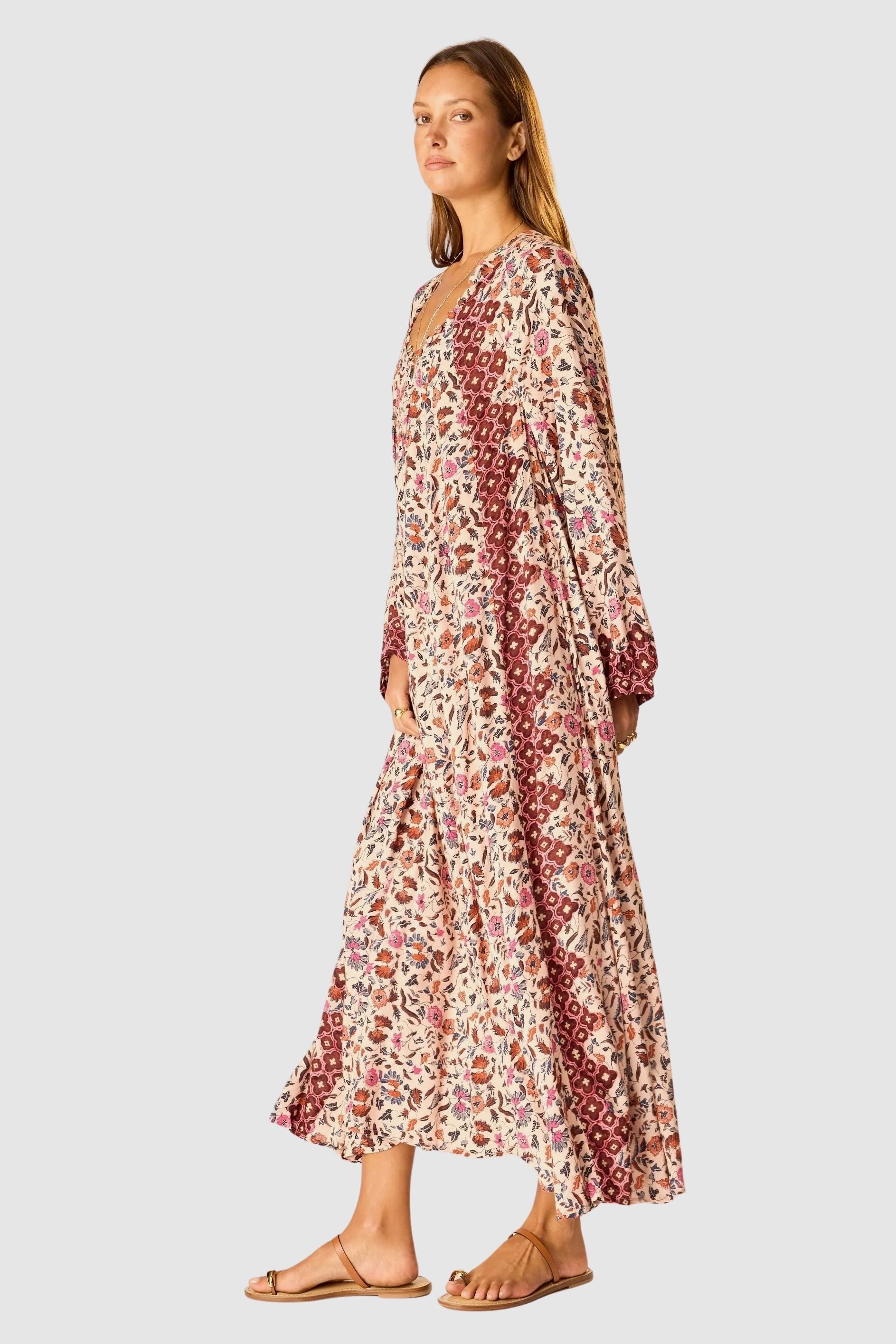 Natalie Martin Fiore Maxi Wildflower Spice floral maxi dress side profile with long sleeves and border print
