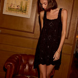 Natalie Martin Nadia Dress Black Silk Embroidery editorial standing view with soft silk movement and mini length silhouette