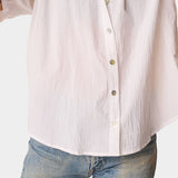Close-up detail of Natalie Martin Violet Top in White Flat Cotton featuring shell buttons and airy cotton fabric