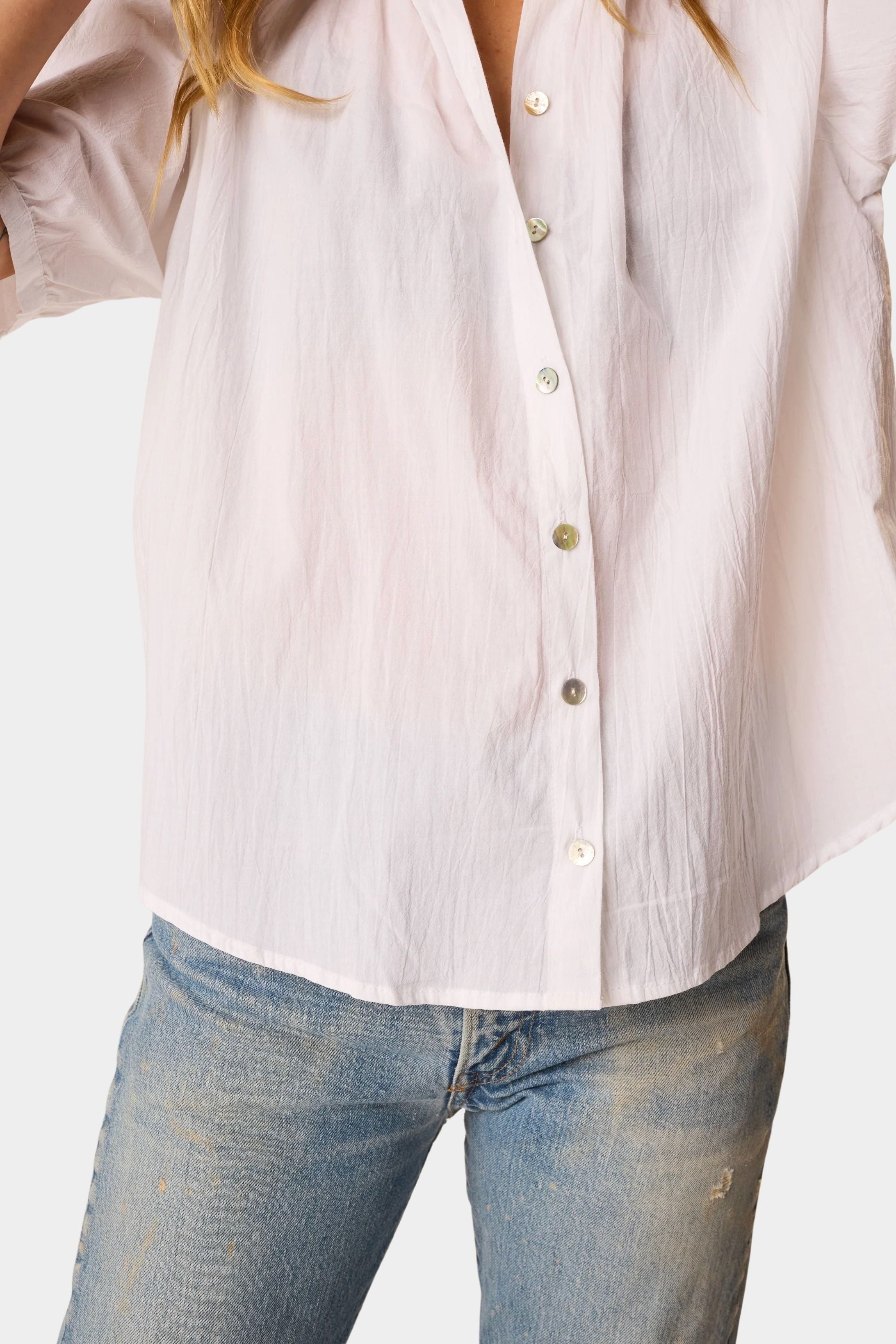 Close-up detail of Natalie Martin Violet Top in White Flat Cotton featuring shell buttons and airy cotton fabric
