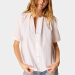 Natalie Martin Violet Top in White Flat Cotton with shell buttons and short sleeves paired with light wash denim