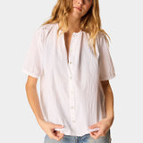 Natalie Martin Violet Top in White Flat Cotton with shell buttons and short sleeves paired with light wash denim