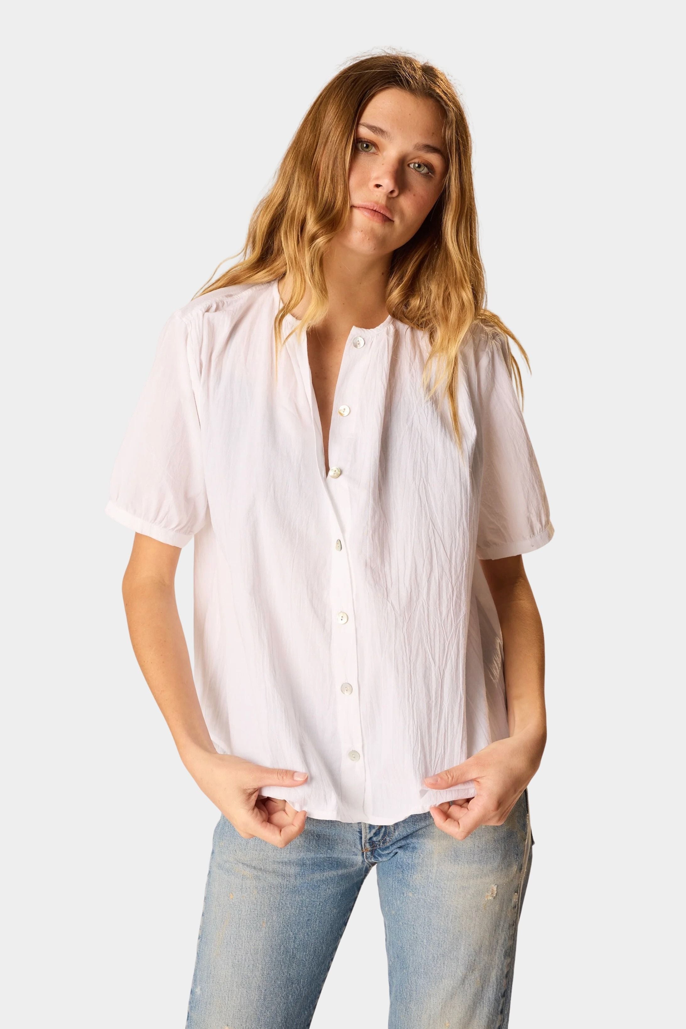 Natalie Martin Violet Top in White Flat Cotton with shell buttons and short sleeves paired with light wash denim