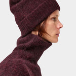 No.6 Knit Beanie in Bordeaux worn with a matching sweater, side view of the folded cuff at YUCCA Denver