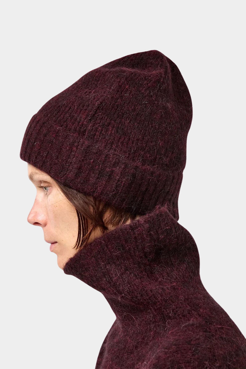 No.6 Knit Beanie in Bordeaux worn slightly slouched, close side view of its knit texture