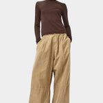 No.6 Lennon Turtleneck in Espresso, full length styling with wide leg tan pants