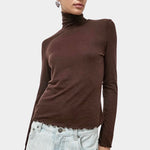 No.6 Lennon Turtleneck in Espresso, front view with lettuce hem and light denim at YUCCA Denver