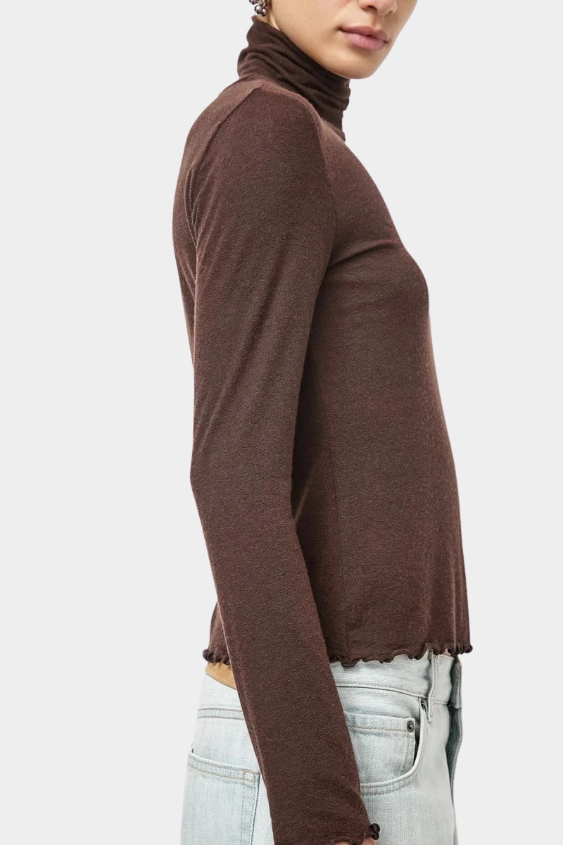No.6 Lennon Turtleneck in Espresso, side detail showing the fabric drape and lettuce hem