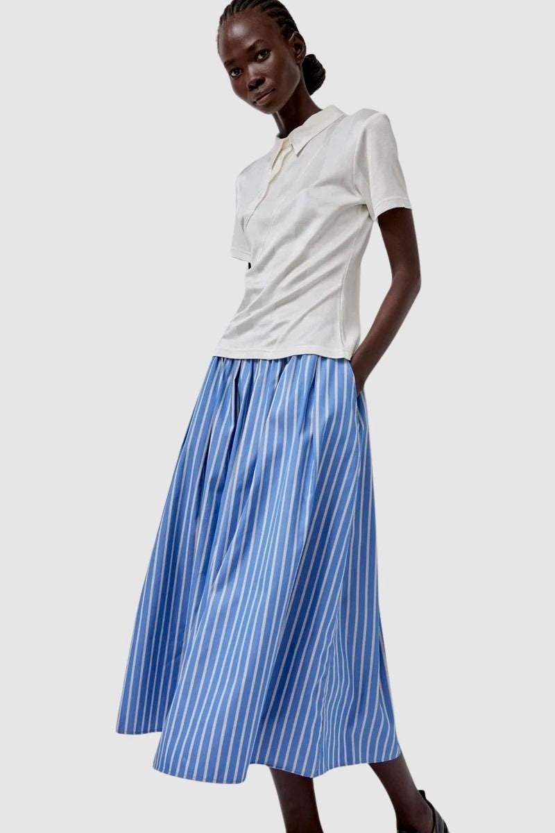 No.6 Mel Skirt in Eton Stripe blue and white striped cotton midi skirt styled with cream polo top front view